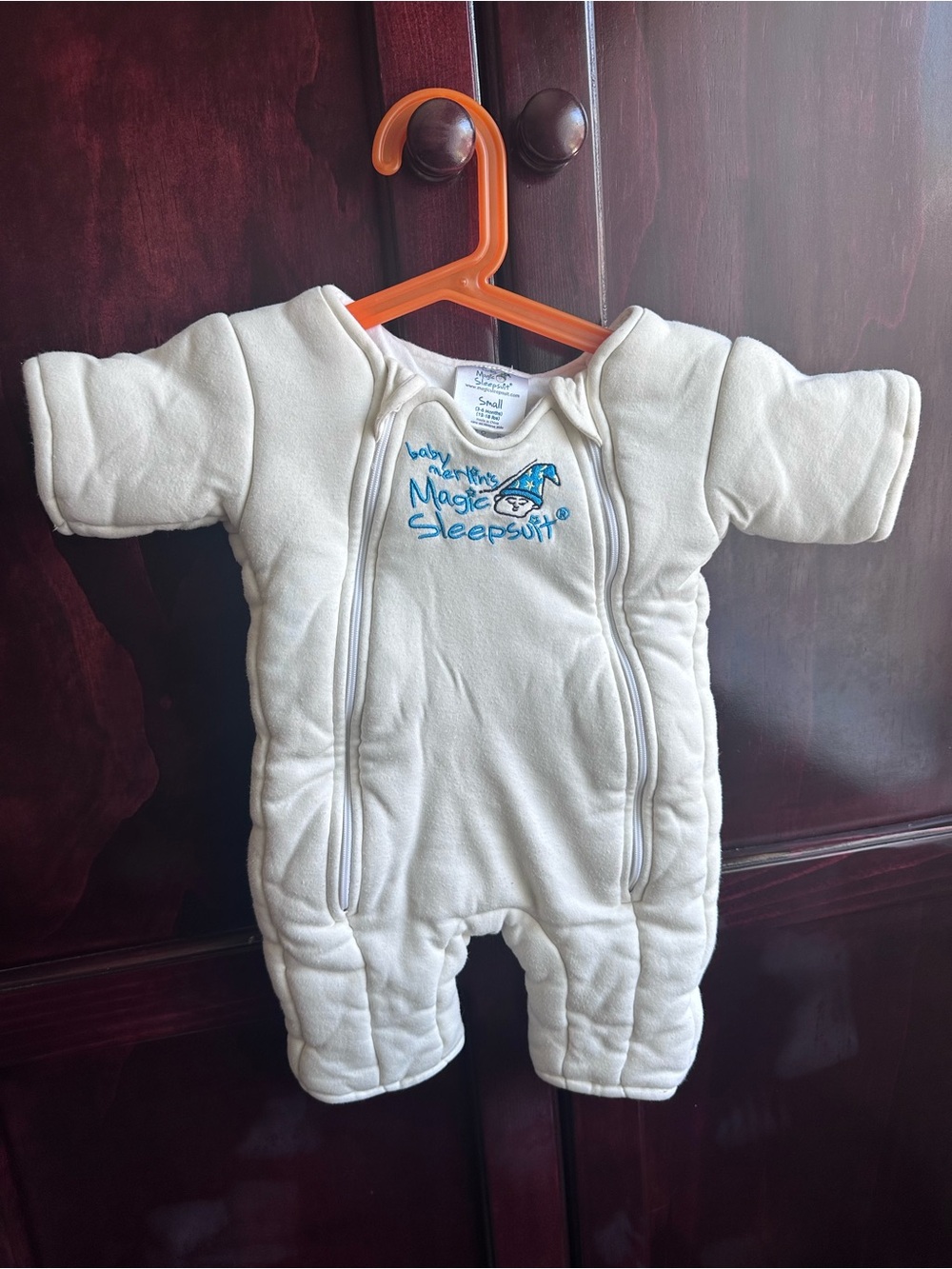 Baby Merlin’s Magic Sleepsuit Baby Onesie - Cream light yellow